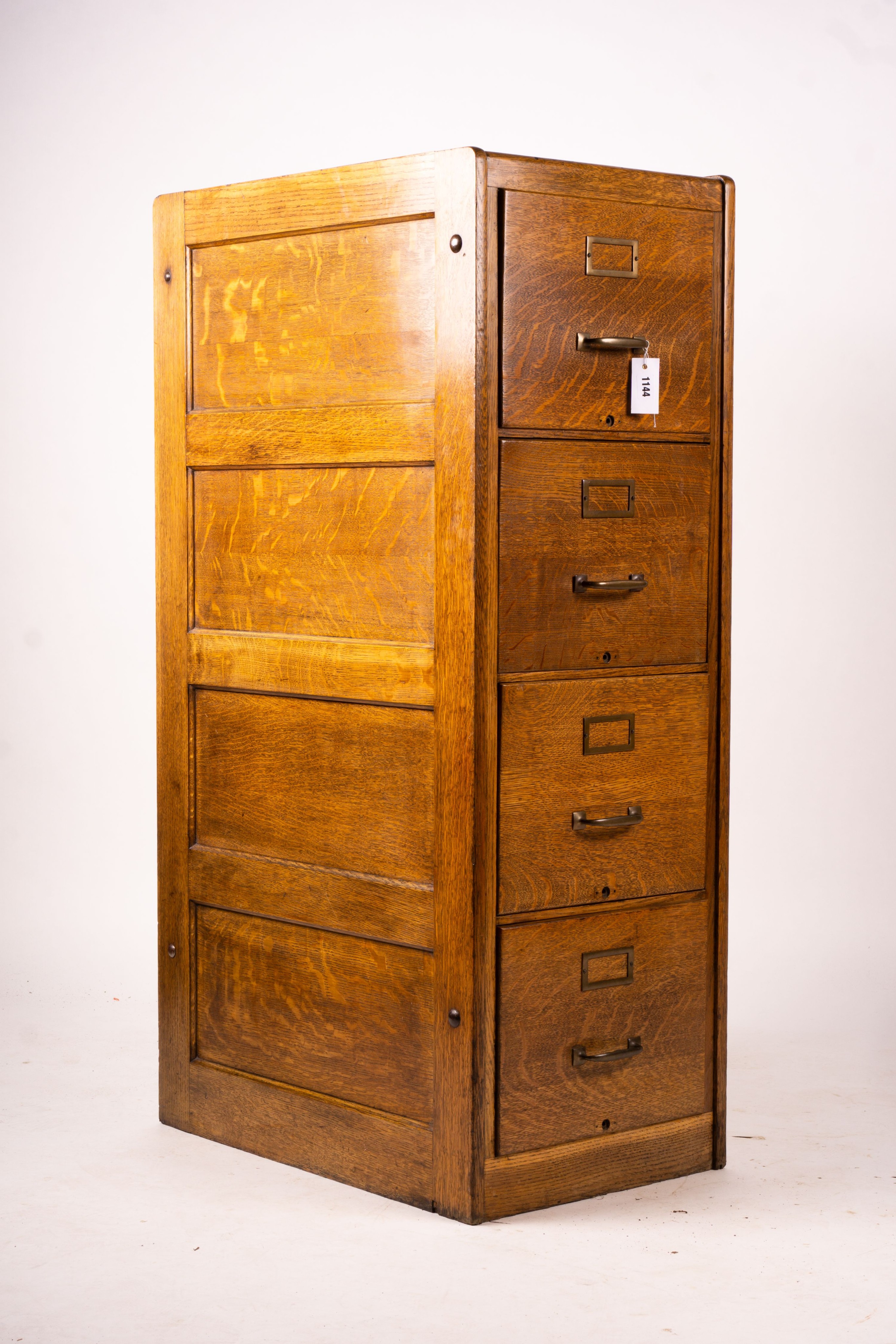 An early 20th century oak four drawer filing cabinet, W.44cm D.70cm. H.132cm